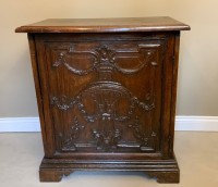 An Italian carved walnut cabinet Image 1