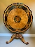 A fine marquetry centre table in the manner of Edward Holmes Baldock