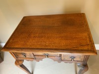 A George III oak lowboy Image 11