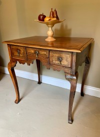 A George III oak lowboy Image 1