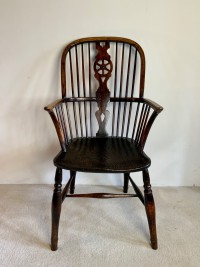 A wheel back Windsor arm chair Image 1