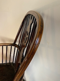 A wheel back Windsor arm chair Image 2