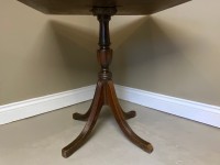 A decorative mahogany based occasional table Image 3