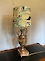 A gilt metal table lamp with handmade shade