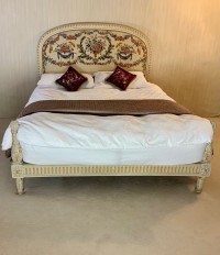 A king size polychrome and parcel gilt bed Image 1